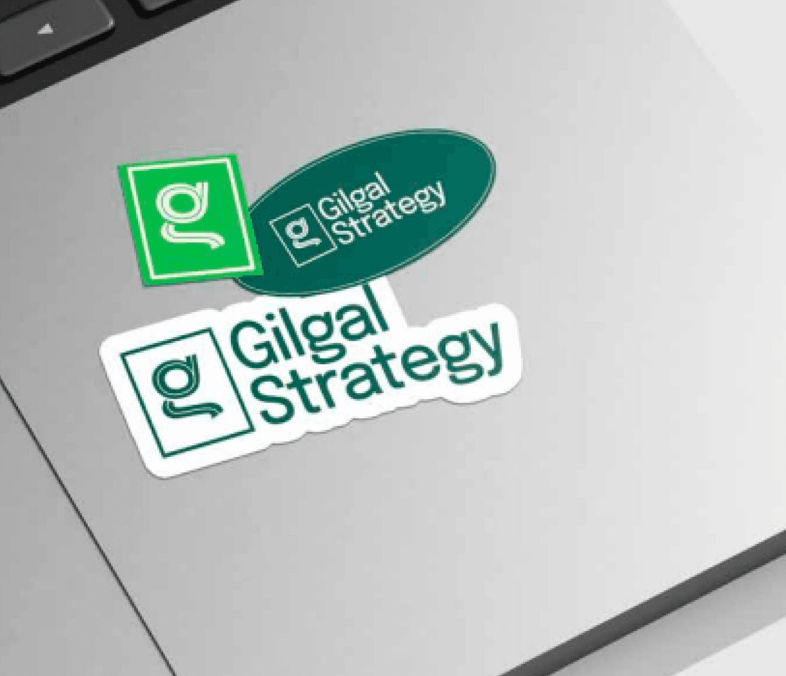 Gilgal Strategy green logo stickers on a laptop